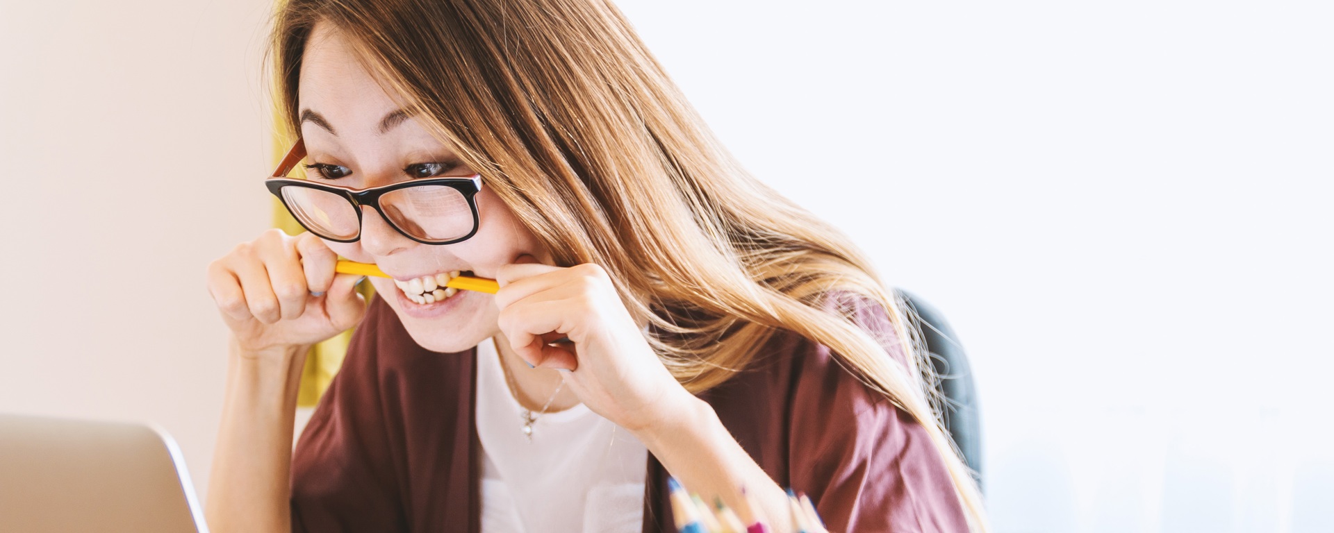 Woman on laptop choosing between a personal loan from Instant Finance and BNPL through Afterpay