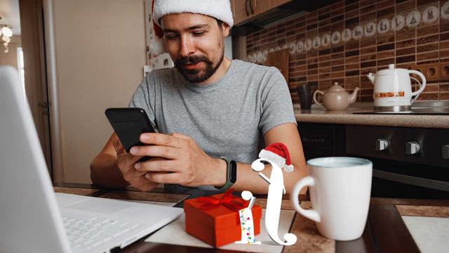 Man in santa hat using phone and laptop, sitting next to I and F characters from Instant Finance