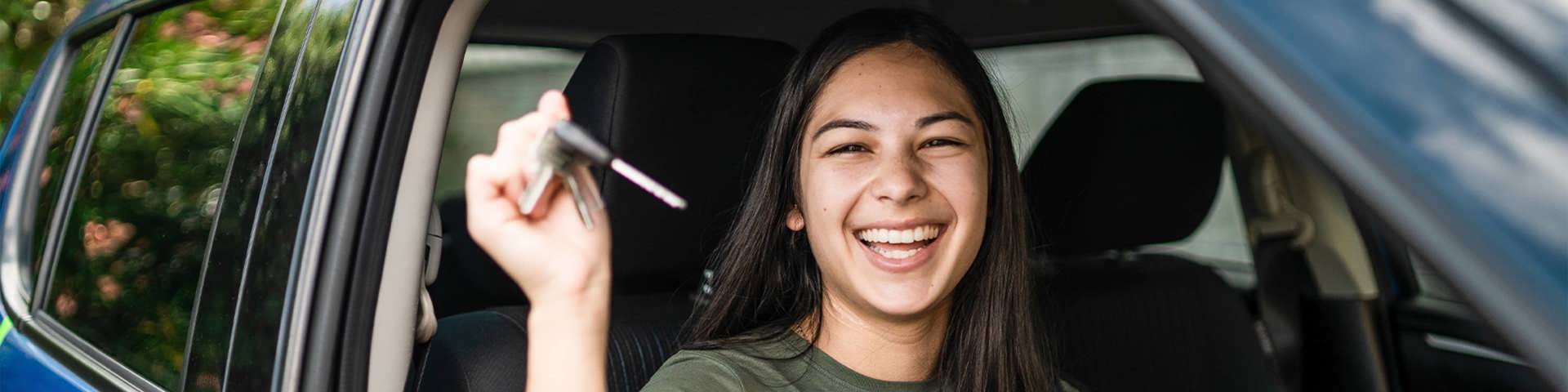 Instant Finance Car Loan. Woman holding keys to new car