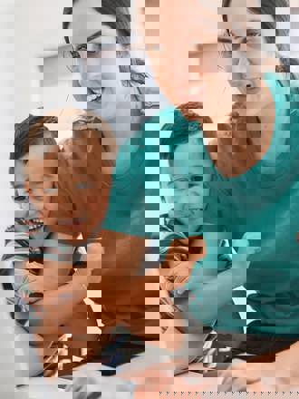 Instant Finance How to get a loan. Woman with son and dog looking at a laptop computer