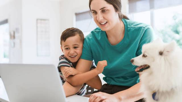 Instant Finance How to get a loan. Woman with son and dog looking at a laptop computer