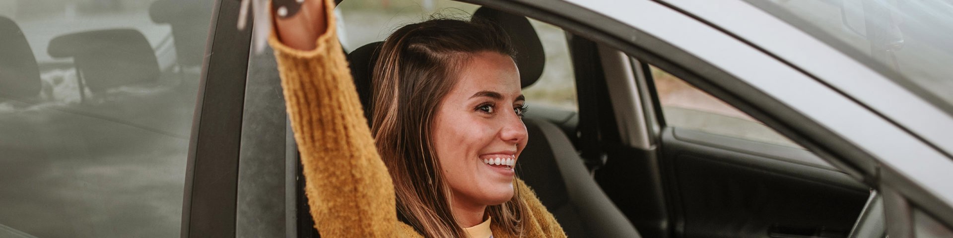 Instant Finance Personal Loans. Woman Holding Car Keys. Personalised Interest Rates